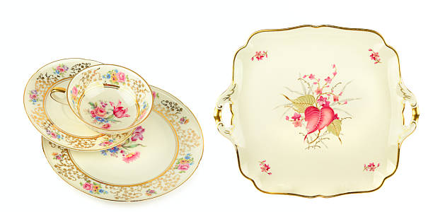 istock Vintage porcelain tea set with floral patterns isolated on white. 2253602347