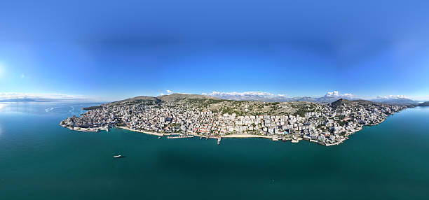 Sarande/a is a city in Albania and the seat of Sarande Municipality. Geographically, the city is located on an open sea gulf of the Ionian Sea within the Mediterranean Sea. Stretching along the Albanian Ionian Sea Coast, Sarande has a Mediterranean climate with over 300 sunny days a year. In ancient times, the city was known as Onchesmus or Onchesmos, and was a port-town of Chaonia in ancient Epirus. It owes its modern name to the nearby Byzantine monastery of the Forty Saints by which it became known from the High Middle Ages. Sarande today is known for its deep blue Mediterranean waters. Near Sarande are the remains of the ancient city of Butrint, a UNESCO World Heritage site. In recent years, Sarande has seen a steady increase in tourists, many of them coming by cruise ships. Visitors are attracted by the natural environment of Sarande and its archaeological sites. (Wikipedia)