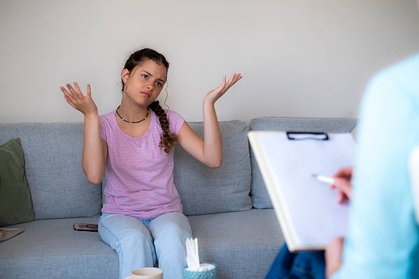 istock Frustrated young woman shrugging during therapy session 2253605840