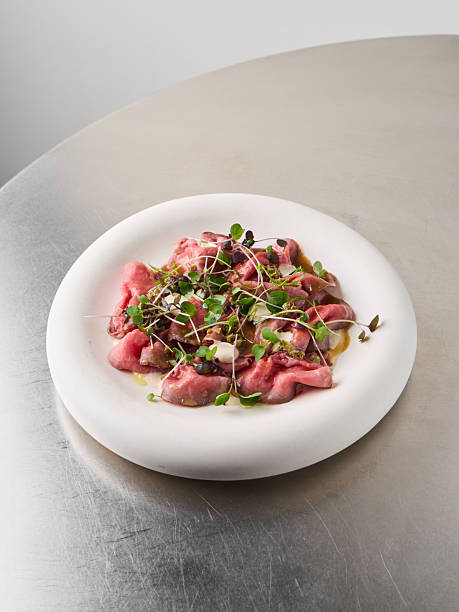 istock pink beet gnocchi with microgreens, chef tasting plate 2253608153