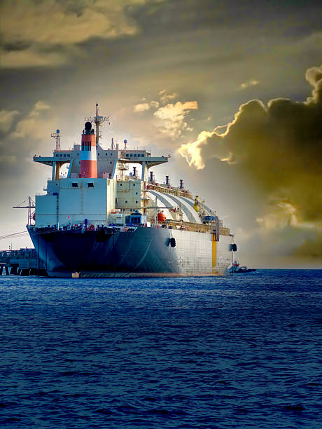 LNG tanker in port under dramatic sky