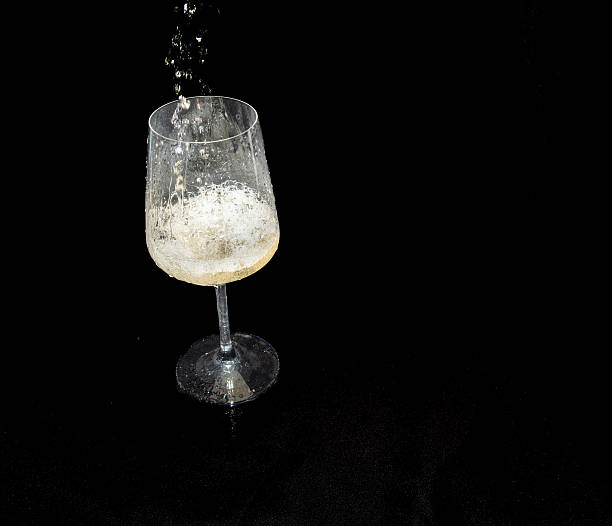 istock A Splash of White Wine in a Stem Glass 2253612201