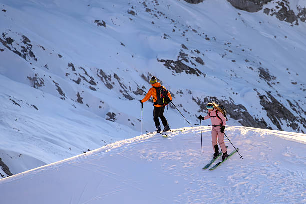 istock Skiers Ascending Snowy Mountain Slope 2253612813