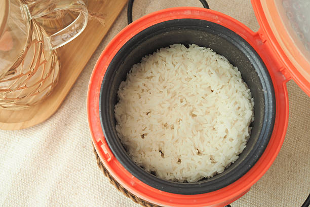 istock Cooking rice in a rice cooker for a perfect meal 2253614184