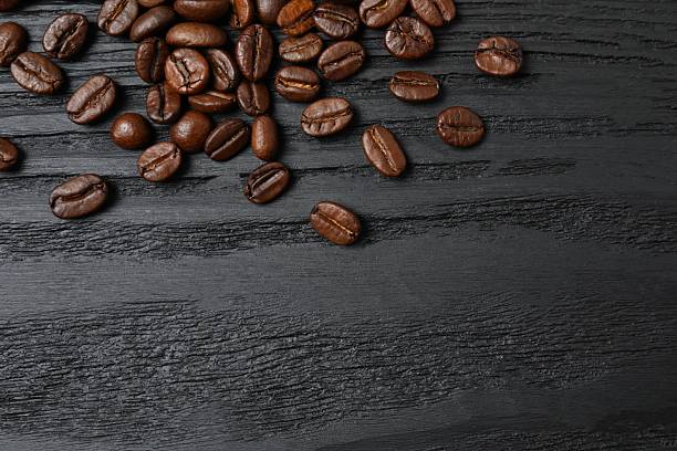 istock Fresh coffee beans on wooden background 2253614706