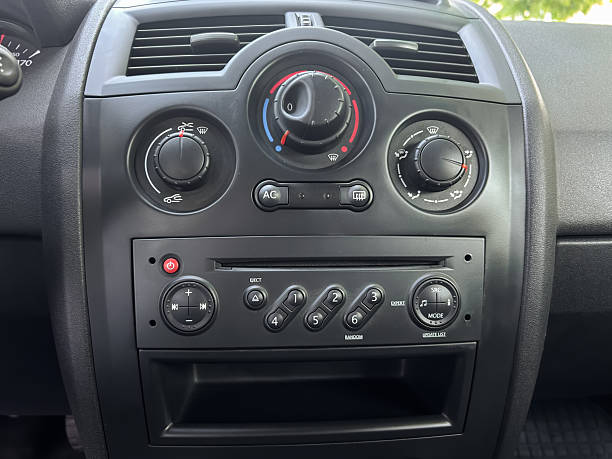 istock A closeup view showcasing the intricate design of modern car dashboard controls, which prominently features both the air conditioning system and the audio system for enhanced driving experience 2253615350