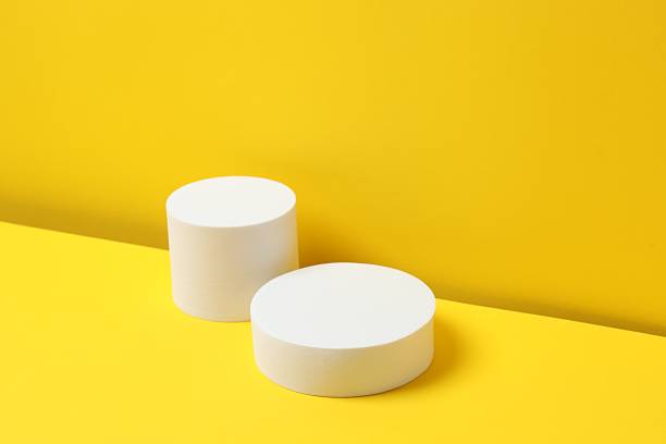 istock White podiums on a yellow background 2253615505