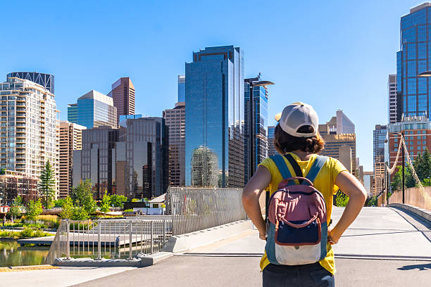istock Tourist admiring calgary skyline on a sunny day from a bridge 2253616185