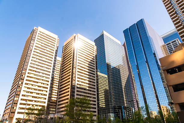 istock Sunlight reflecting on modern office buildings in calgary, canada 2253616252