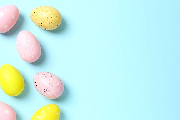 istock Happy Easter. Colorful eggs on color background, space for text or advertising 2253616320