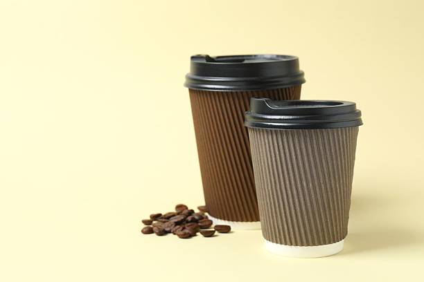 istock Paper cups with plastic lid on light background. Coffee to go 2253616361