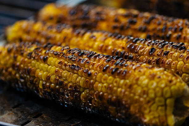 istock Tasty roasted corn at Christmas market stall 2253618425