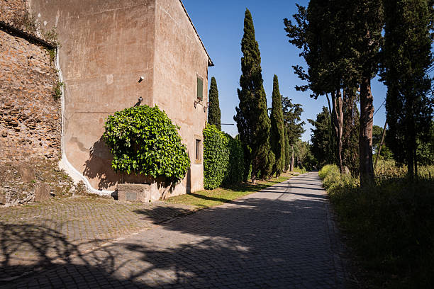 Ancient roman latin script on the Appian Way Park, on white marble.