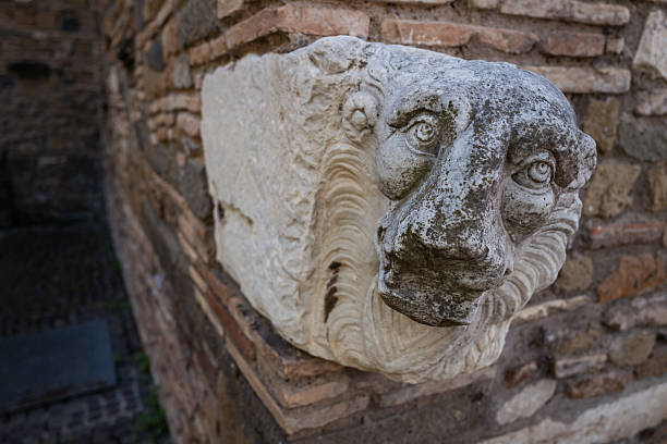 A close-up of a statue of a lion near a church in Genoa, Italy