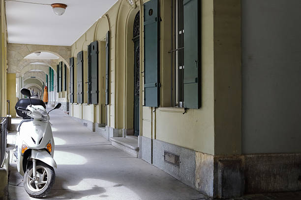 Bern, Switzerland, April 16, 2019: The sidewalk under the arcades is a place where people can walk and enjoy the city's atmosphere, while also finding shelter from the sun or precipitation.
