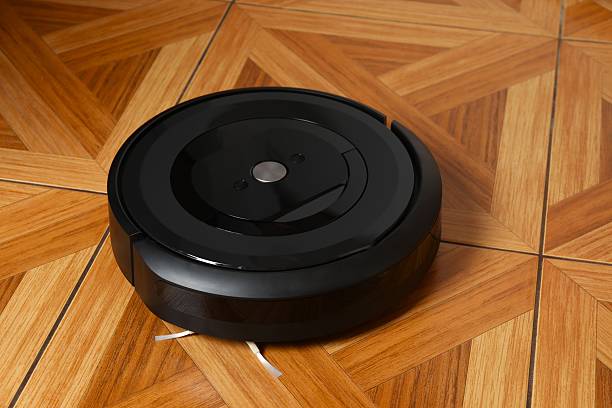 istock Robot vacuum cleaner on the floor in room 2253620201