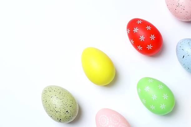 istock Happy Easter. Colorful eggs on white background, space for text or advertising 2253620354