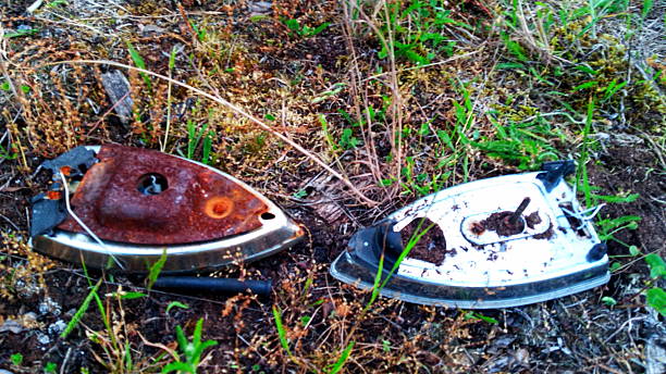 istock Two Rusted Vintage Clothes Irons on Reclaimed Land 2253624219