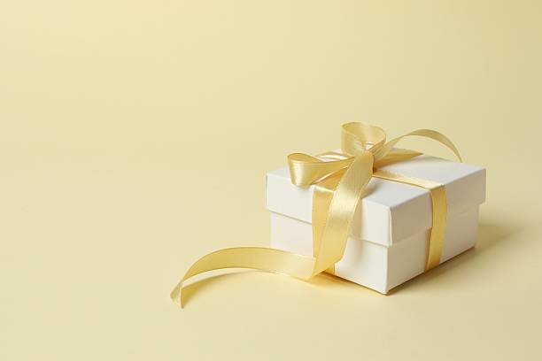 istock Beautiful festive gift box on color background 2253629146