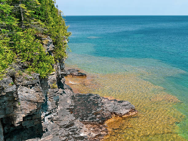 istock Limestone cliff and clear turquoise water 2253632453