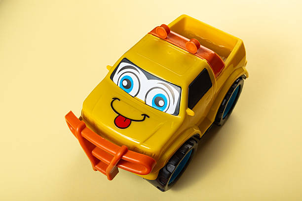 children's plastic toy car with eyes on the playground