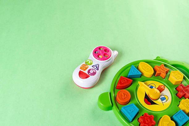 istock Colorful toys on a green background 2253632743