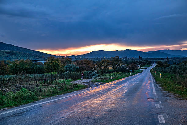 the sun setting behind the clouds on a rainy day