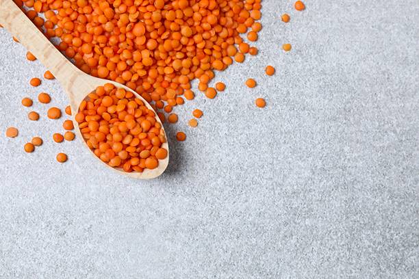 Red lentils on a gray background