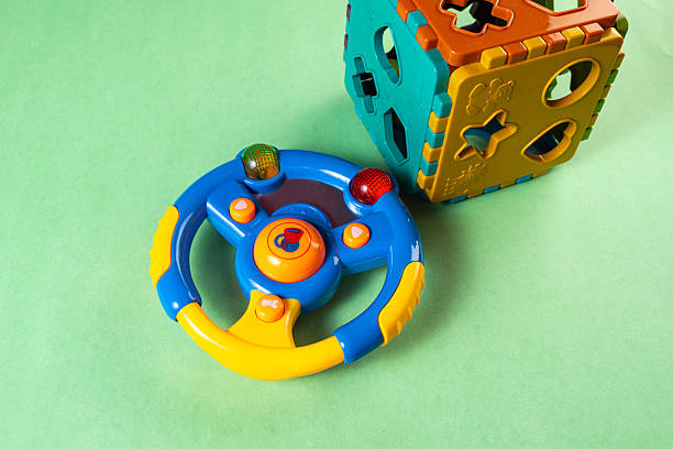 istock Colorful toys on a green background 2253633843