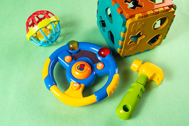 istock Colorful toys on a green background 2253633881