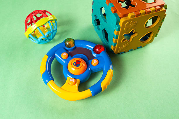 istock Colorful toys on a green background 2253633882