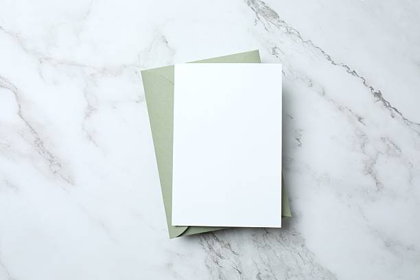 istock Flat lay with paper envelope, blank card on marble. Ideal for wedding invitations, event announcements, or feminine branding 2253634129