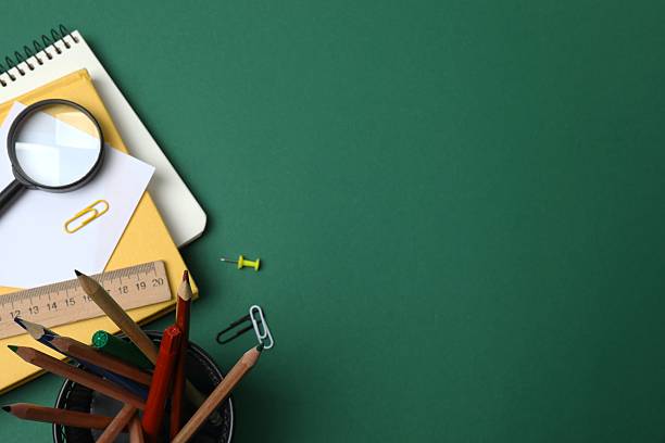 istock Flat lay with school stationery on green background, top view 2253634512
