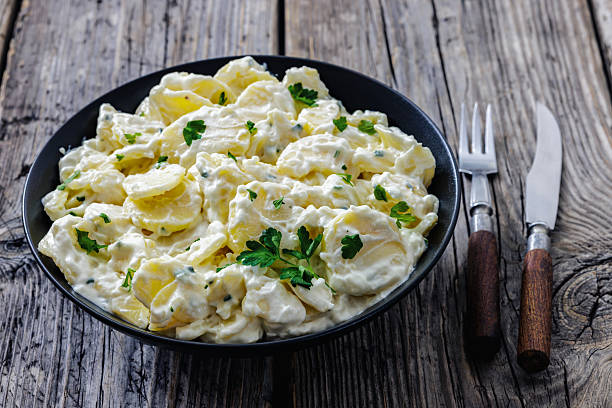 istock German potato salad in a bowl, close-up 2253634586