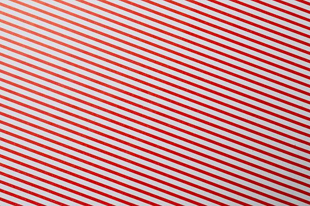 Candy cane striped pattern. Seamless Christmas red background. Peppermint wrapping print. Cute caramel package texture. Xmas holiday diagonal lines. Abstract geometric. Red white striped background