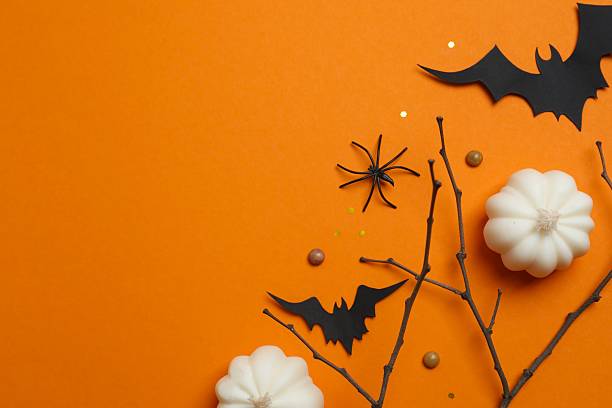 istock Vertical Halloween festive background design featuring bats, pumpkin and decorative branches. Halloween concept 2253634629