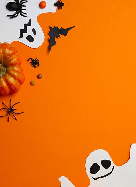 istock Halloween holiday decorations including pumpkins, spiders, ghosts and bats on orange background 2253635606