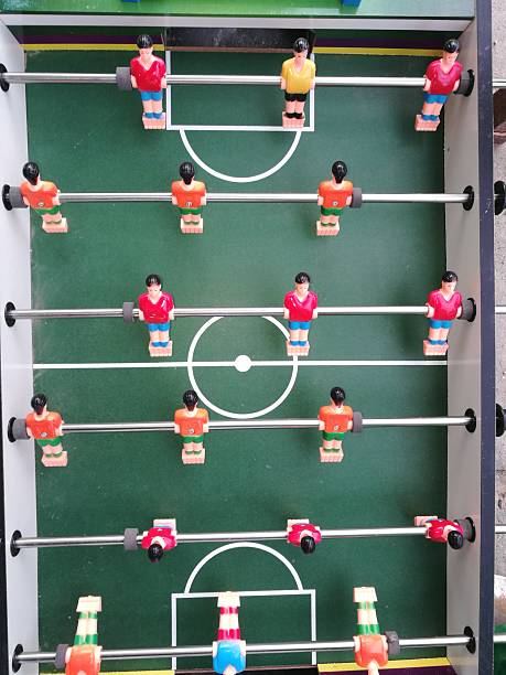 istock Colorful foosball table with player figurines 2253636665