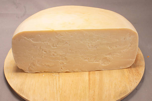 istock Artisan Cheese Round Presented On Aged Wooden Surface Emphasizing Freshness 2253637169