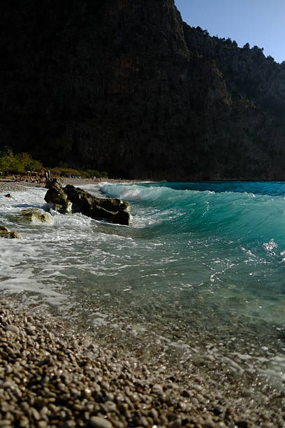 Aerial view of Butterfly Valley, also known as Kelebekler Vadisi, a protected natural canyon and beach with its crsytal clear turquoise waters on the Mediterranean coast near Ölüdeniz in Fethiye, Turkey.