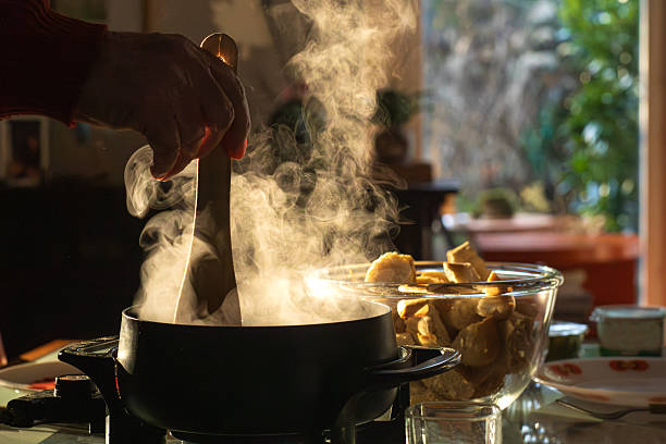 istock Steaming cheese fondue in pot, ready to share 2253640856