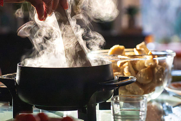 istock Steaming cheese fondue in pot, ready to share 2253640861