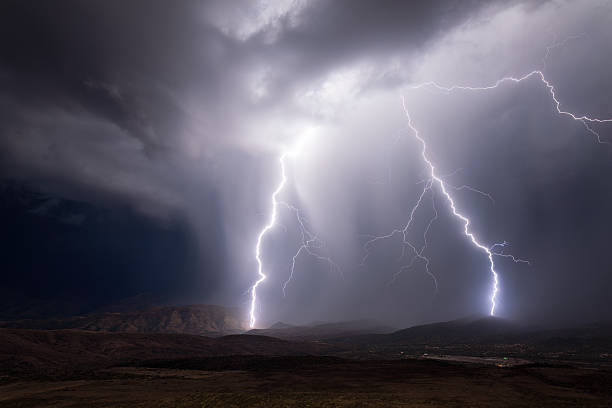 istock Lightning bolt strikes illuminate the night sky in a monsoon storm 2253641640