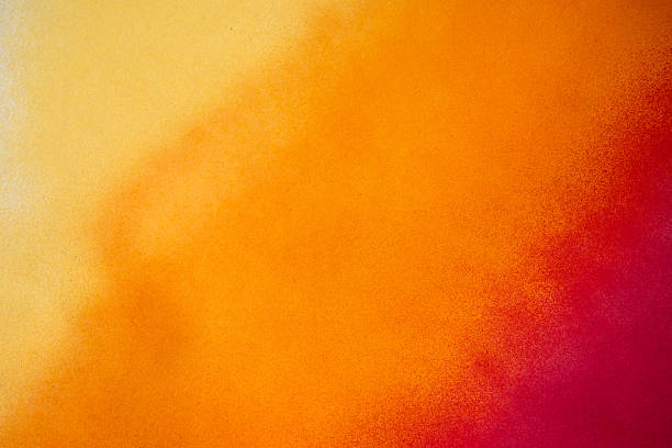 A background painted with warm color gradient spray paint