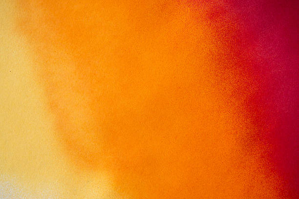 istock A background painted with warm color gradient spray paint 2253642352