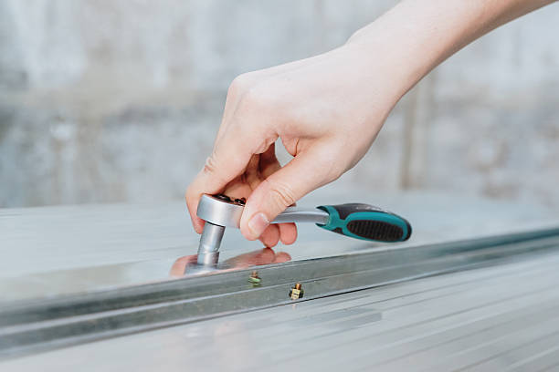 istock The hand of an unrecognizable guy installing a fastener using a ratchet wrench. 2253642709