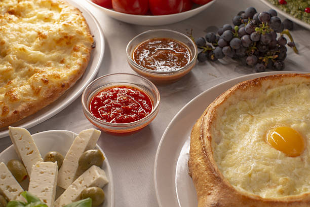 Homestyle brunch featuring warm cheese bread and various sides, Experience homestyle brunch with freshly baked cheese bread and selection of tasty sides