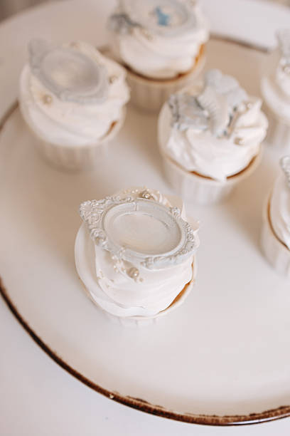 Enjoy our Elegant Cupcakes, topped with Whipped Frosting and Decorative Accents, perfect for celebrations like birthdays, weddings, and any event where delightful sweets are essential