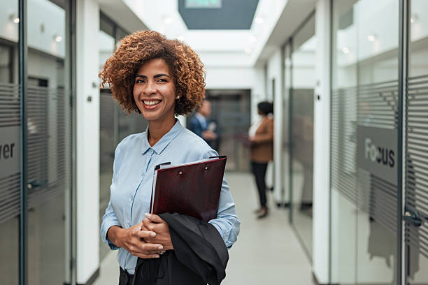 istock Confident Businesswoman in Office Hallway 2253644111