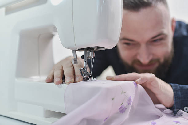 Atelier environment showcasing the detailed process of tailoring, fabric handling, and garment assembly.